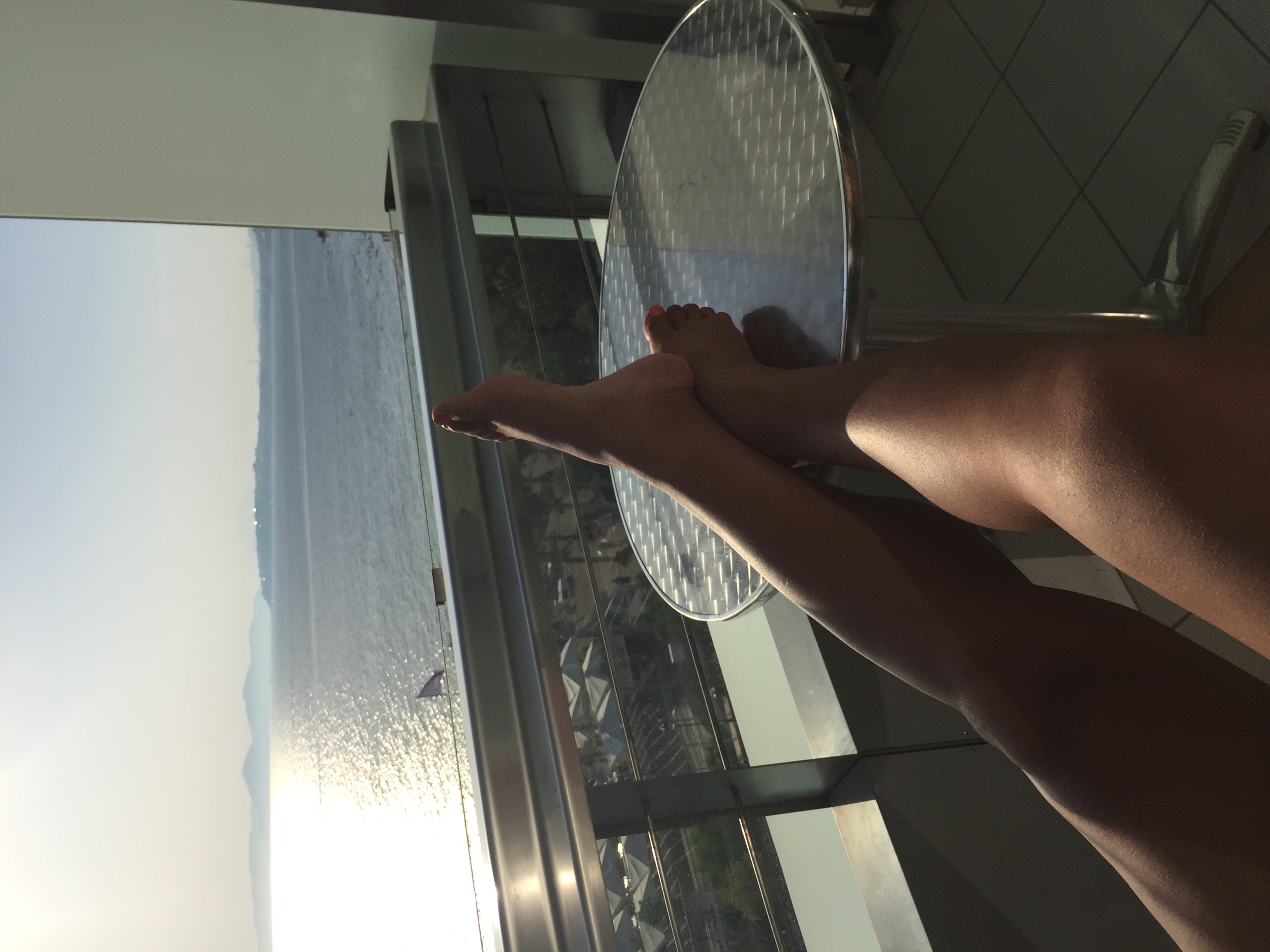 Sajuan relaxing with an Aegean water view