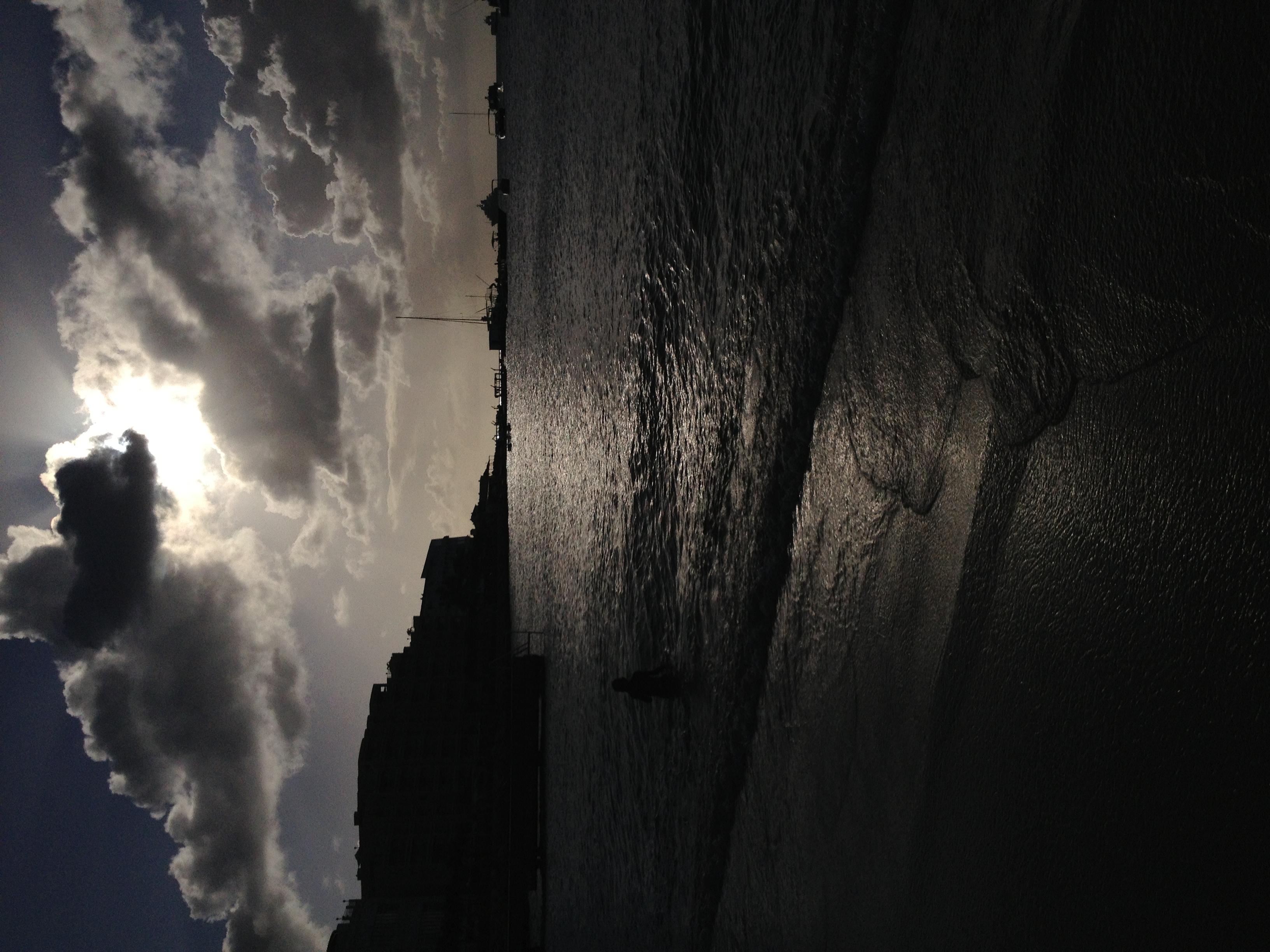 Sun breaking through clouds over the water in St. Maarten